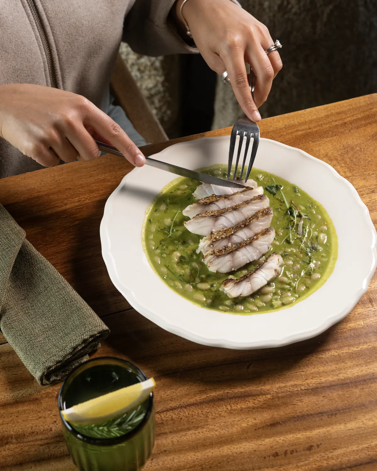 Grilled fish with bean stew, Genovese pesto and yellow lemon